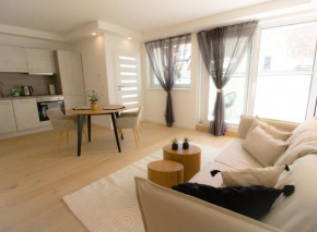 Central relaxation with wooden flair & terrace